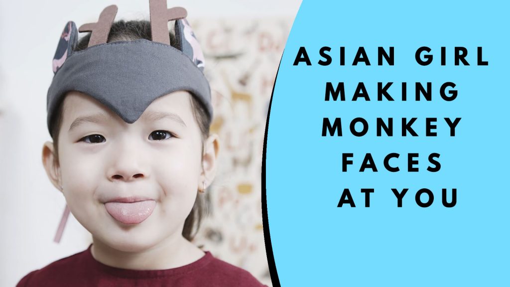 Asian Girl Making Monkey Faces at You